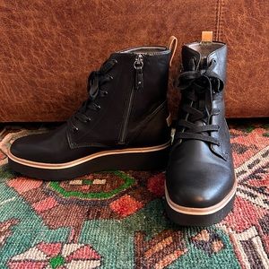 Dr. Scholl’s combat boots; platform heel.